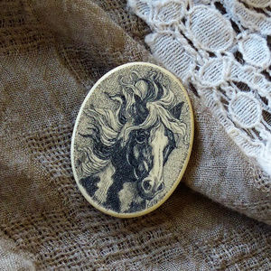 Scrimshaw-like horse pin